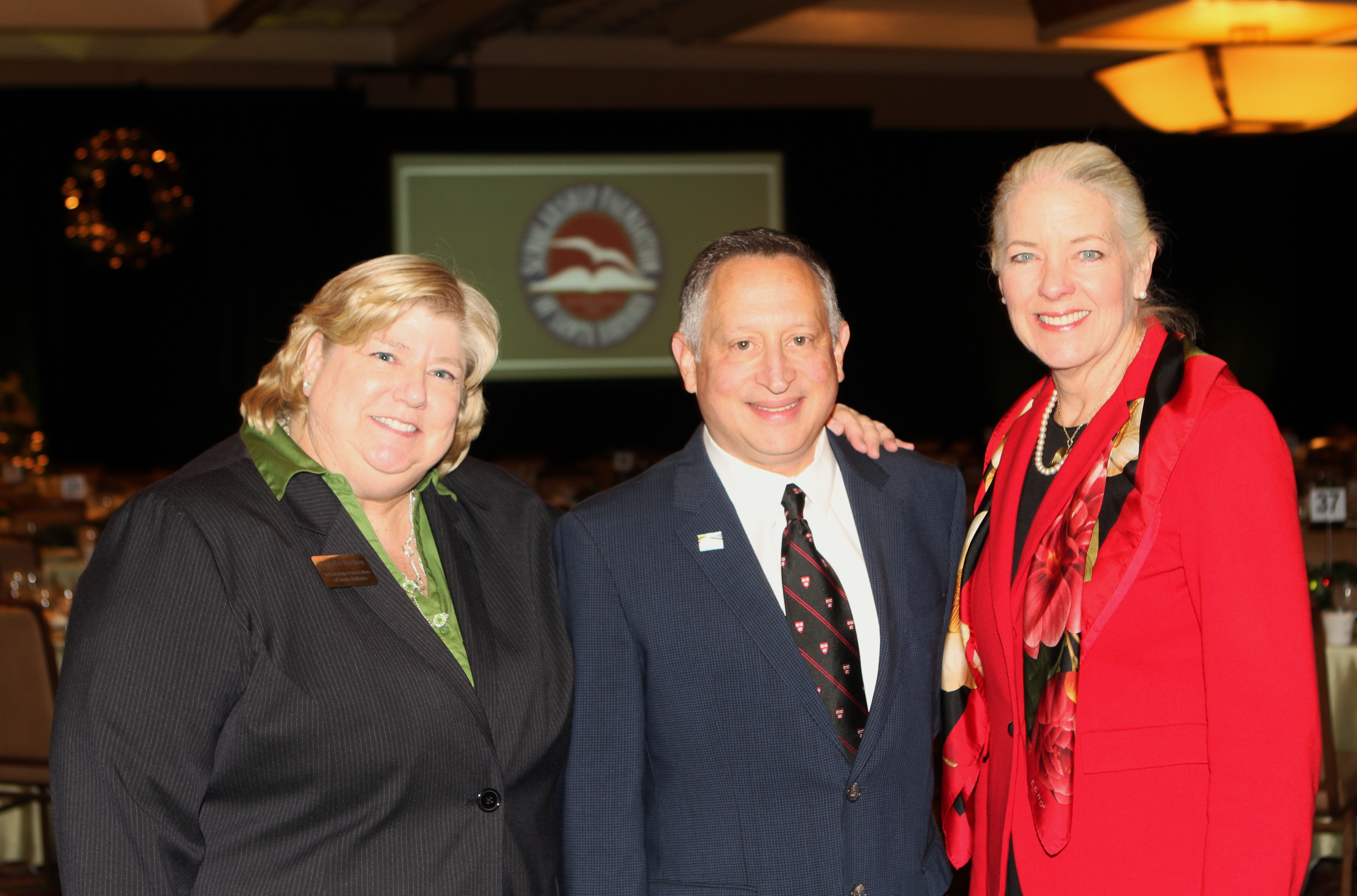 Scholarship Foundation Executive Director Colette Hadley, left, with Community Leader Speaker Ron Gallo and SFSB Board president Janet Garufis.